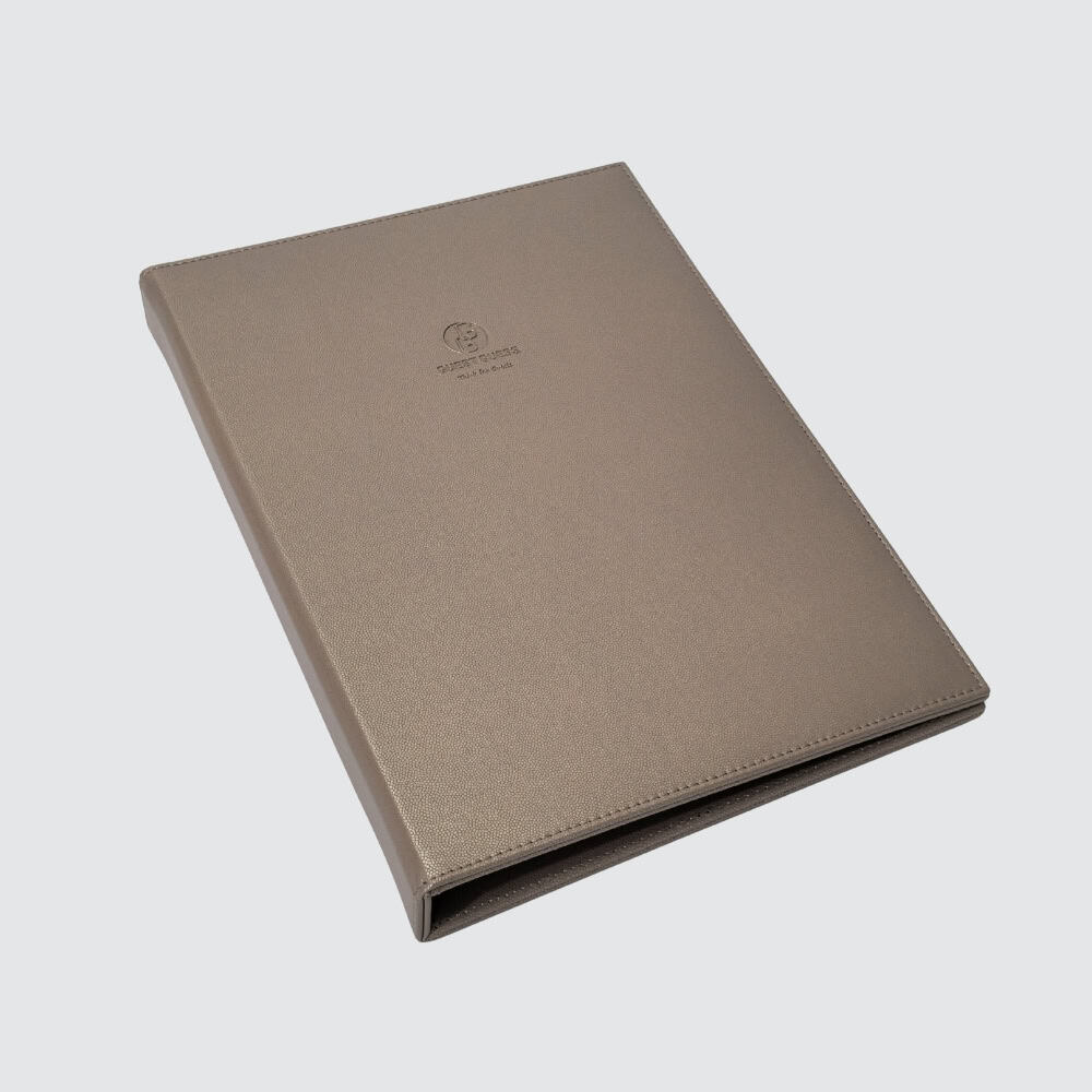 Example of bronze faux leather guest directory holder – additional hotel desk accessory