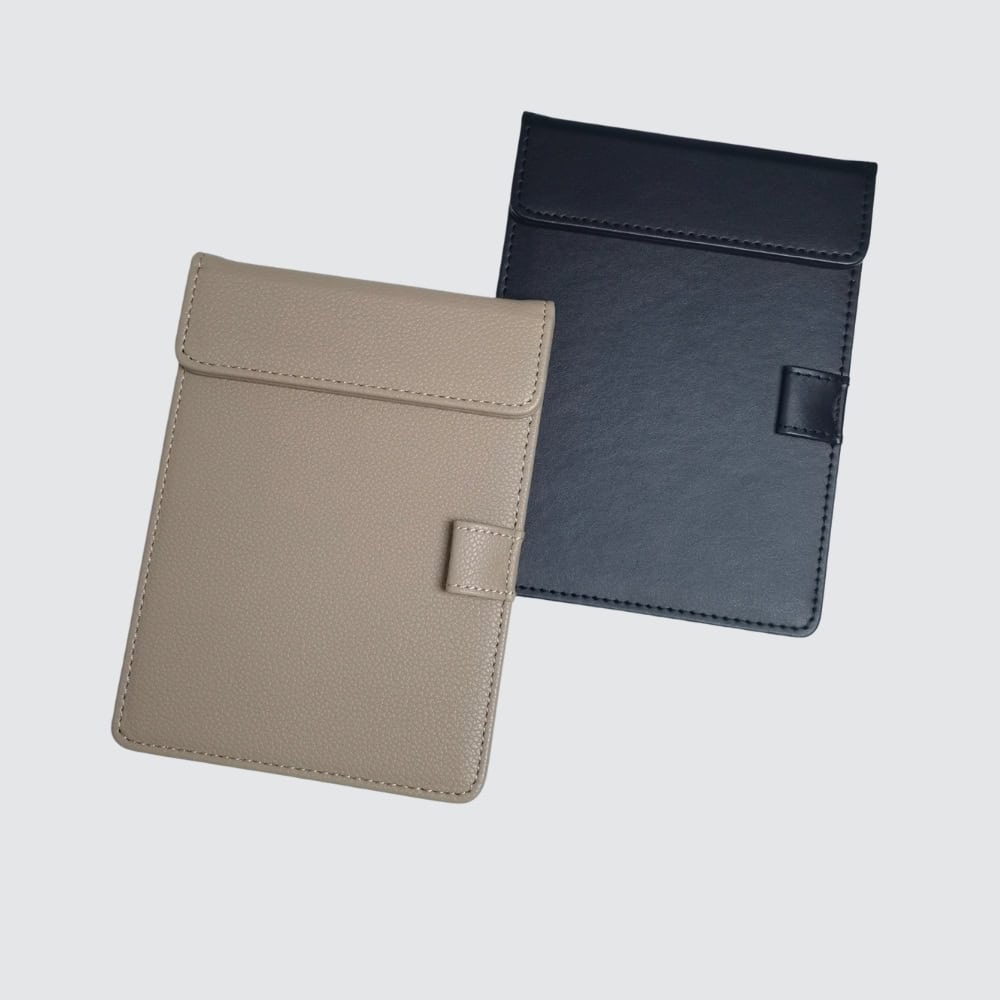 Example of bronze faux leather notepad holder – additional hotel desk supplies
