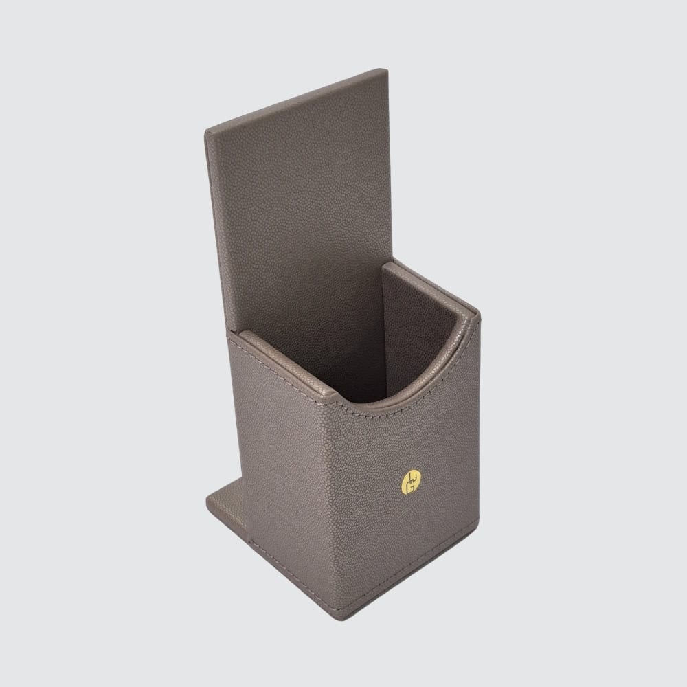 Example of bronze faux leather remote control holder – additional hotel desk accessory